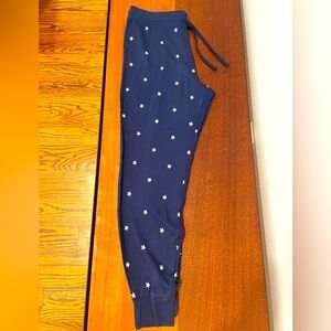 Navy sweatpants with white stars; size M